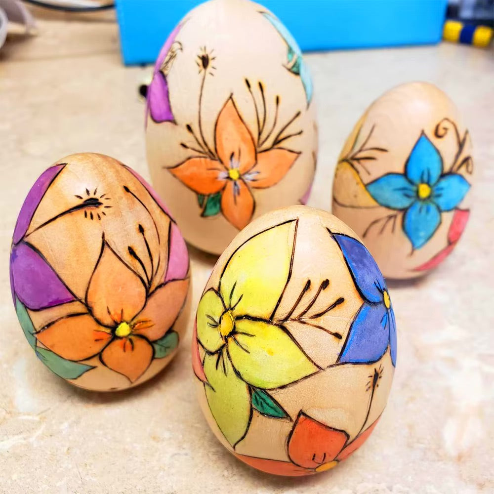 Colorfully decorated wooden Easter eggs with floral designs, perfect for Easter crafts and DIY projects.